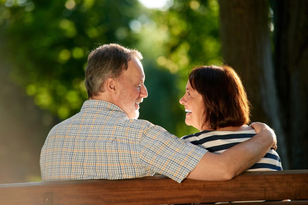 Happy smiling old couple in the park.
